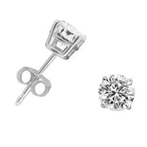 White background photograph of a pair of stud diamond earrings with silver. One is laying on it's side, the other's diamond is facing the viewer.
