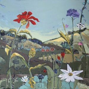 A color photograph of a landscape with rolling green hills in the background and in the foreground are very closeup single flowers in white, orange, red and purple.